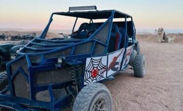 Tourists enjoying a 5-in-1 Safari Adventure in Sharm El Sheikh with buggy ride, Bedouin show, dinner, and stargazing. hasabo travel