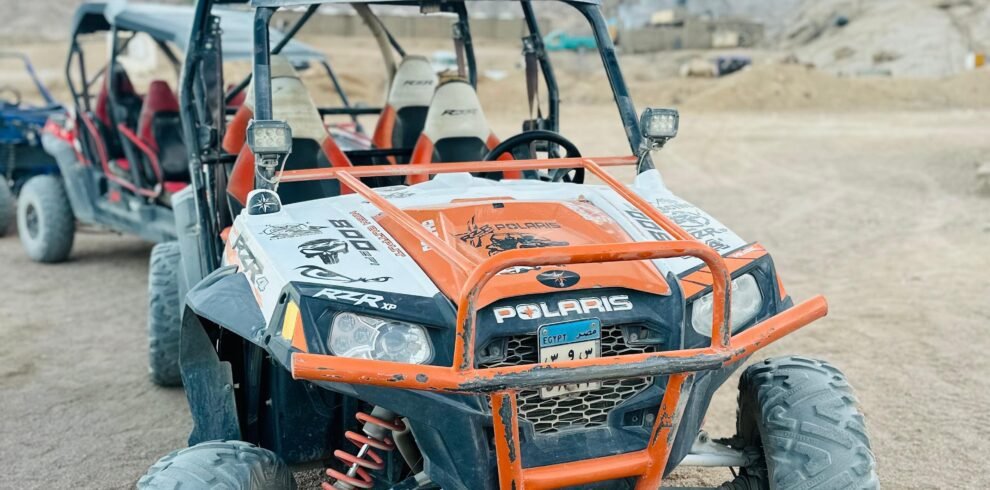 Tourists enjoying a 5-in-1 Safari Adventure in Sharm El Sheikh with buggy ride, Bedouin show, dinner, and stargazing. hasabo travel